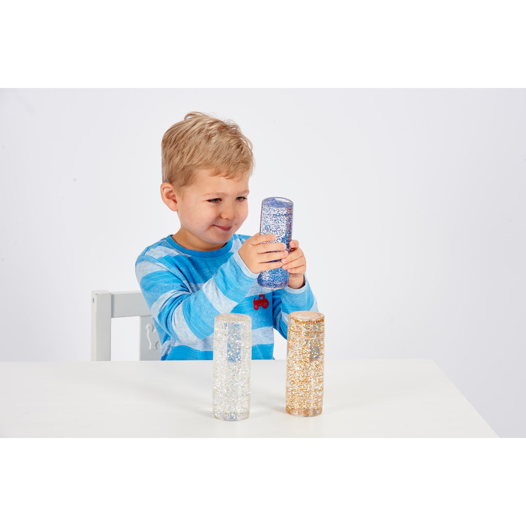 A collection of clear tubes filled with swirling glitter in vibrant colors, designed to provide visual stimulation and calming sensory input.