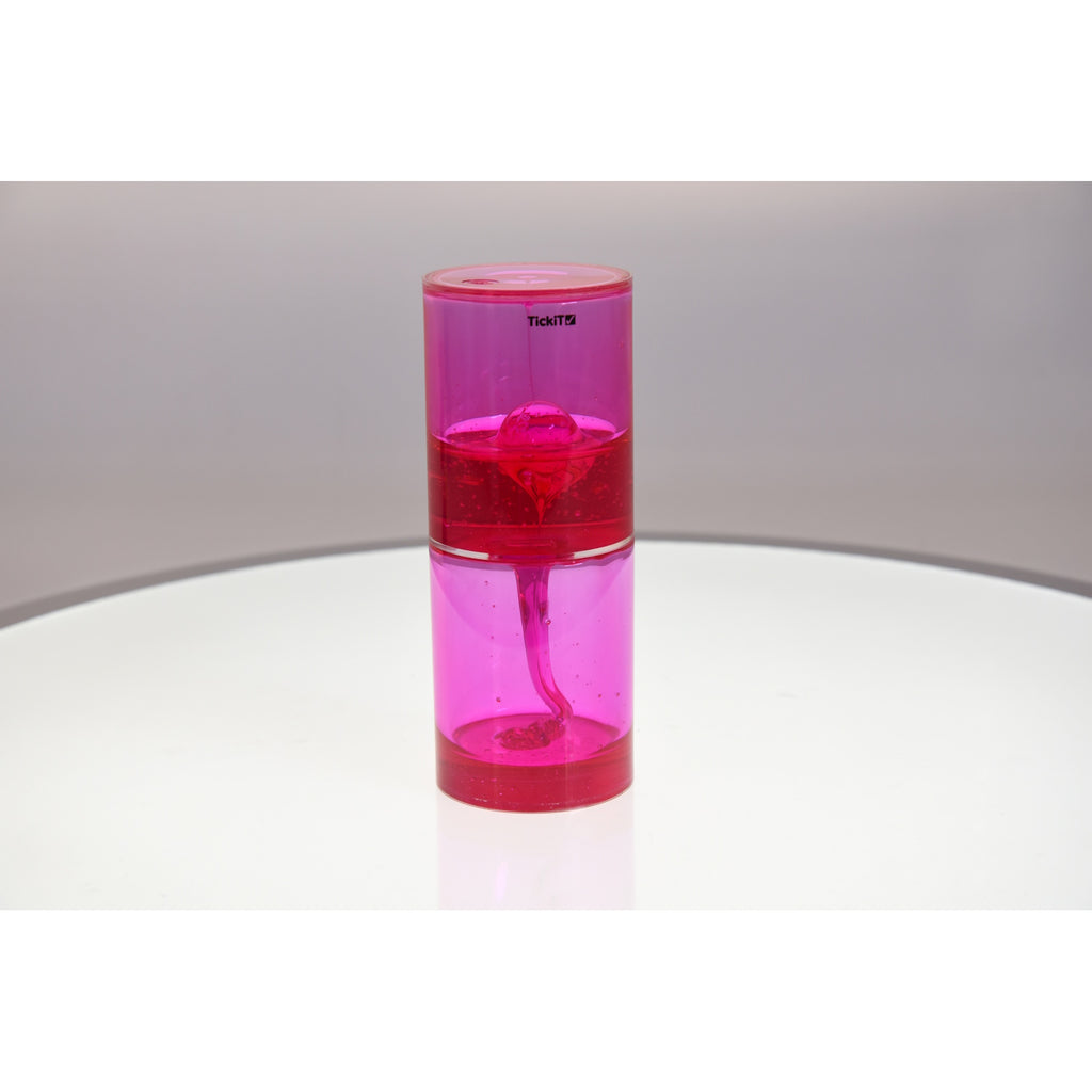 A large, clear tube filled with slow-moving, colorful liquid, designed to captivate attention and support calming sensory experiences.