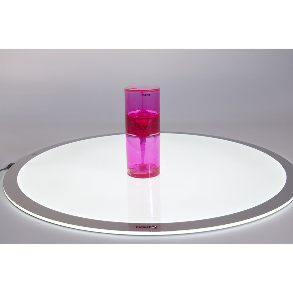 A large, clear tube filled with slow-moving, colorful liquid, designed to captivate attention and support calming sensory experiences.