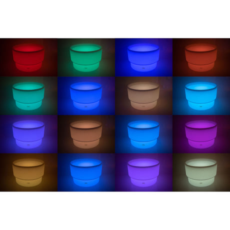 An illuminated LED table with a deep circular well, designed for sensory play, color exploration, and interactive learning activities.