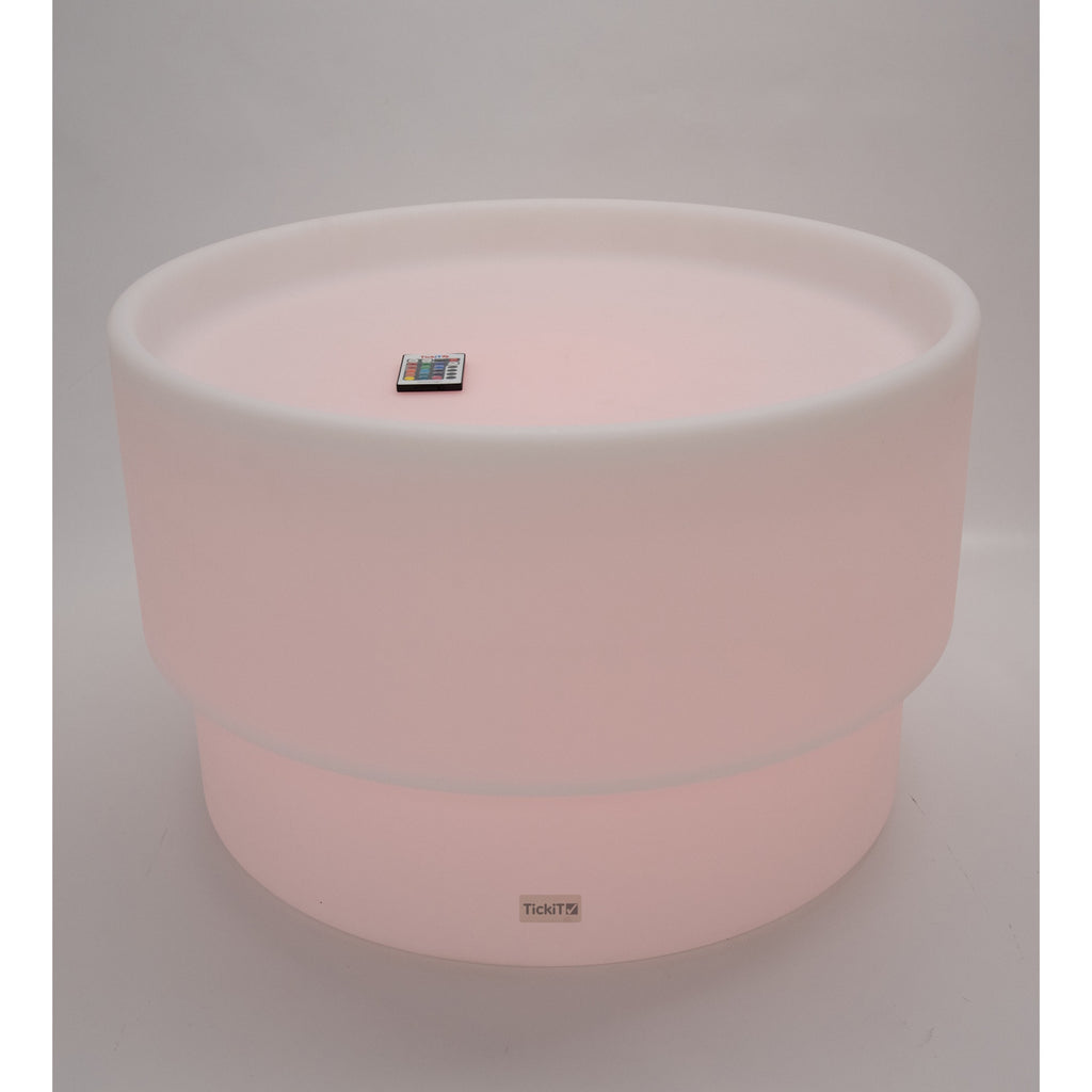 An illuminated LED table with a deep circular well, designed for sensory play, color exploration, and interactive learning activities.