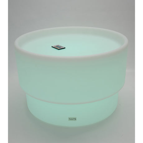 An illuminated LED table with a deep circular well, designed for sensory play, color exploration, and interactive learning activities.