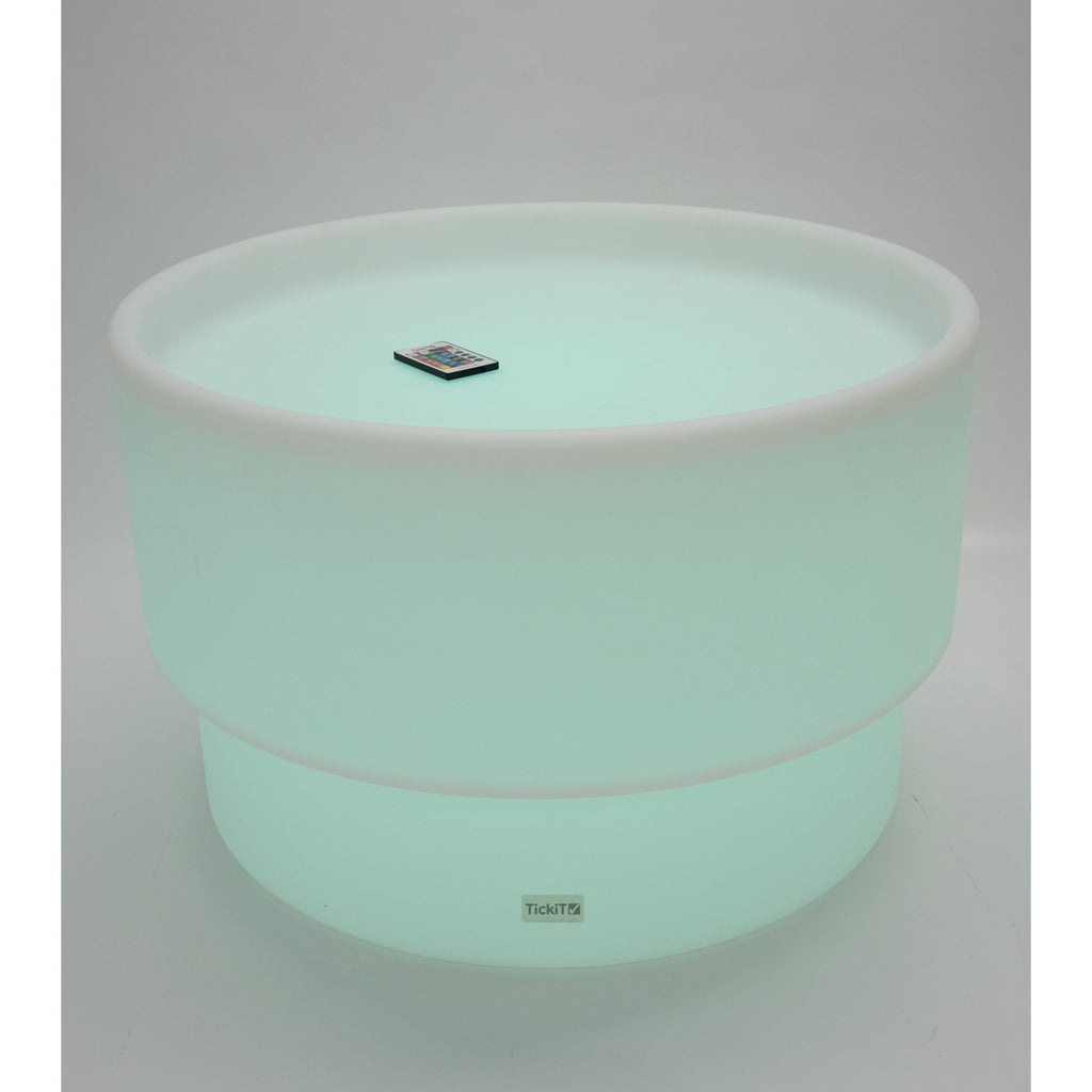 An illuminated LED table with a deep circular well, designed for sensory play, color exploration, and interactive learning activities.