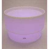 An illuminated LED table with a deep circular well, designed for sensory play, color exploration, and interactive learning activities.