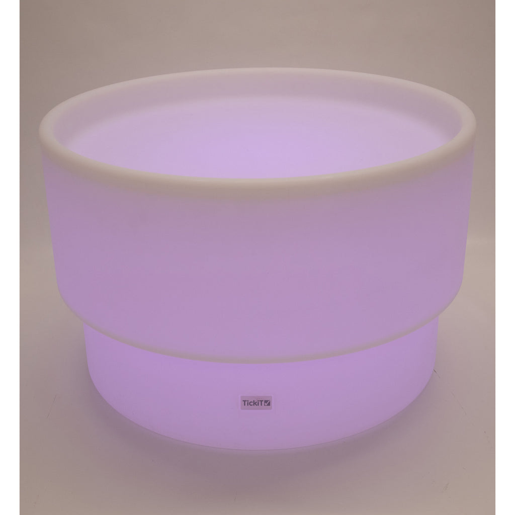 An illuminated LED table with a deep circular well, designed for sensory play, color exploration, and interactive learning activities.