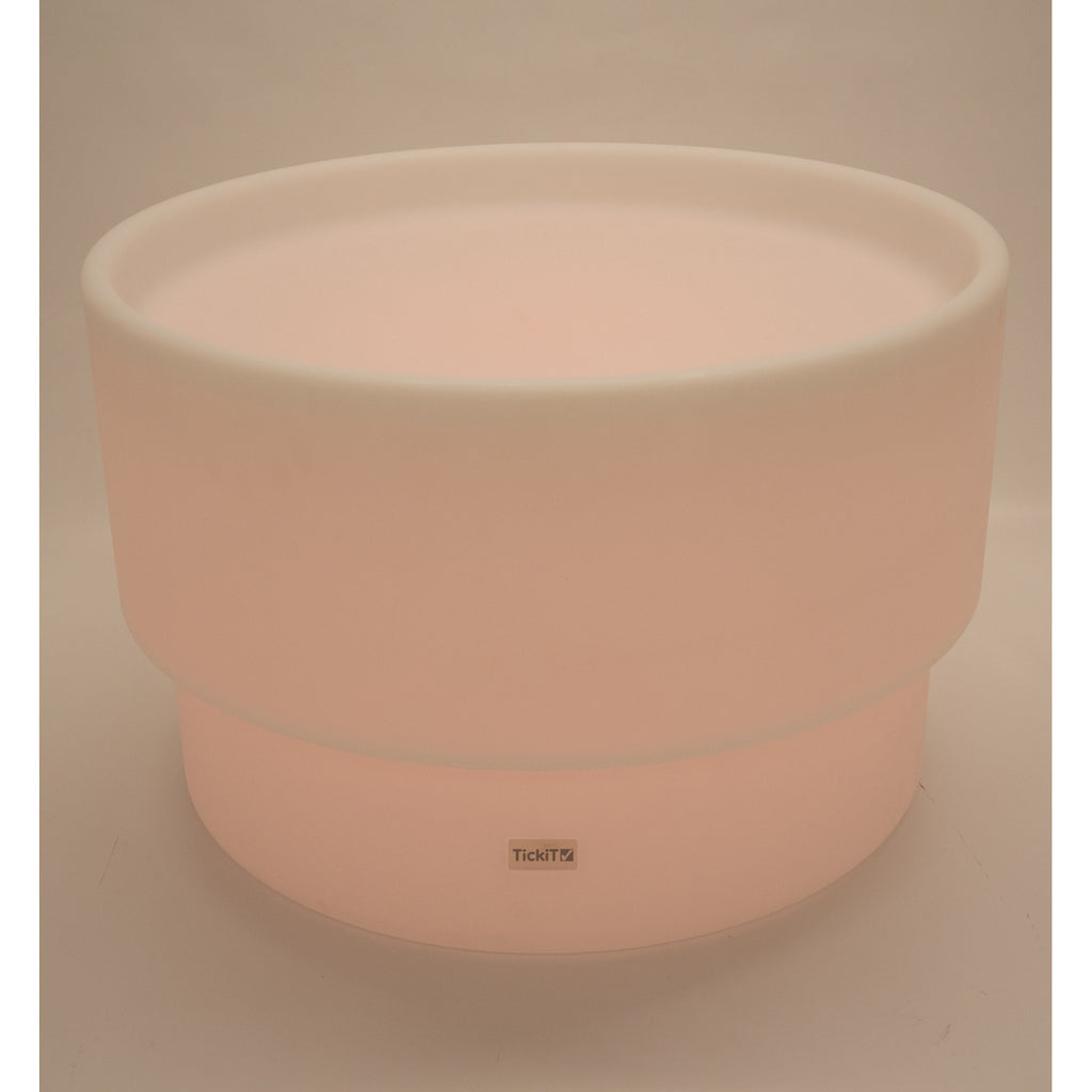 An illuminated LED table with a deep circular well, designed for sensory play, color exploration, and interactive learning activities.