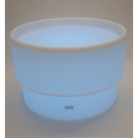 An illuminated LED table with a deep circular well, designed for sensory play, color exploration, and interactive learning activities.