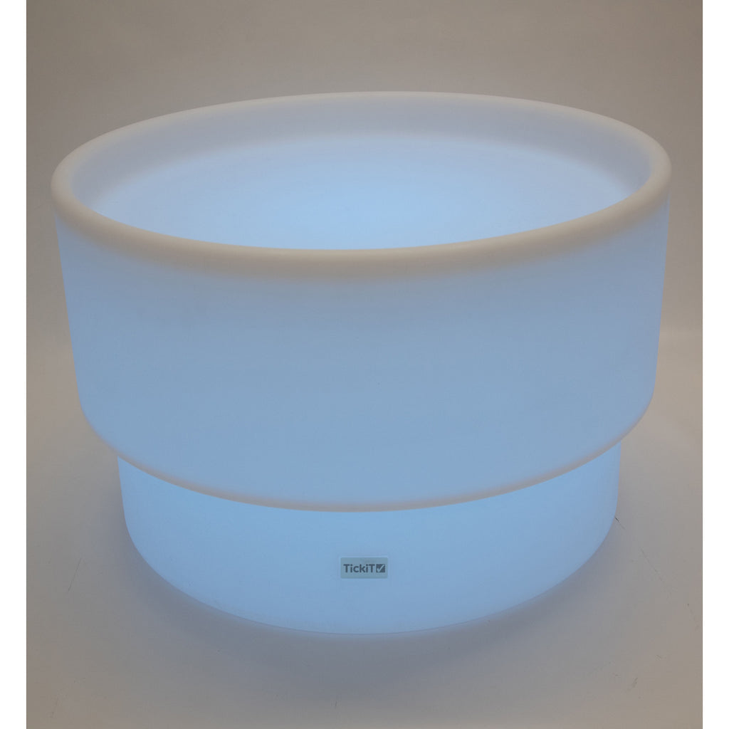 An illuminated LED table with a deep circular well, designed for sensory play, color exploration, and interactive learning activities.
