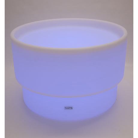 An illuminated LED table with a deep circular well, designed for sensory play, color exploration, and interactive learning activities.