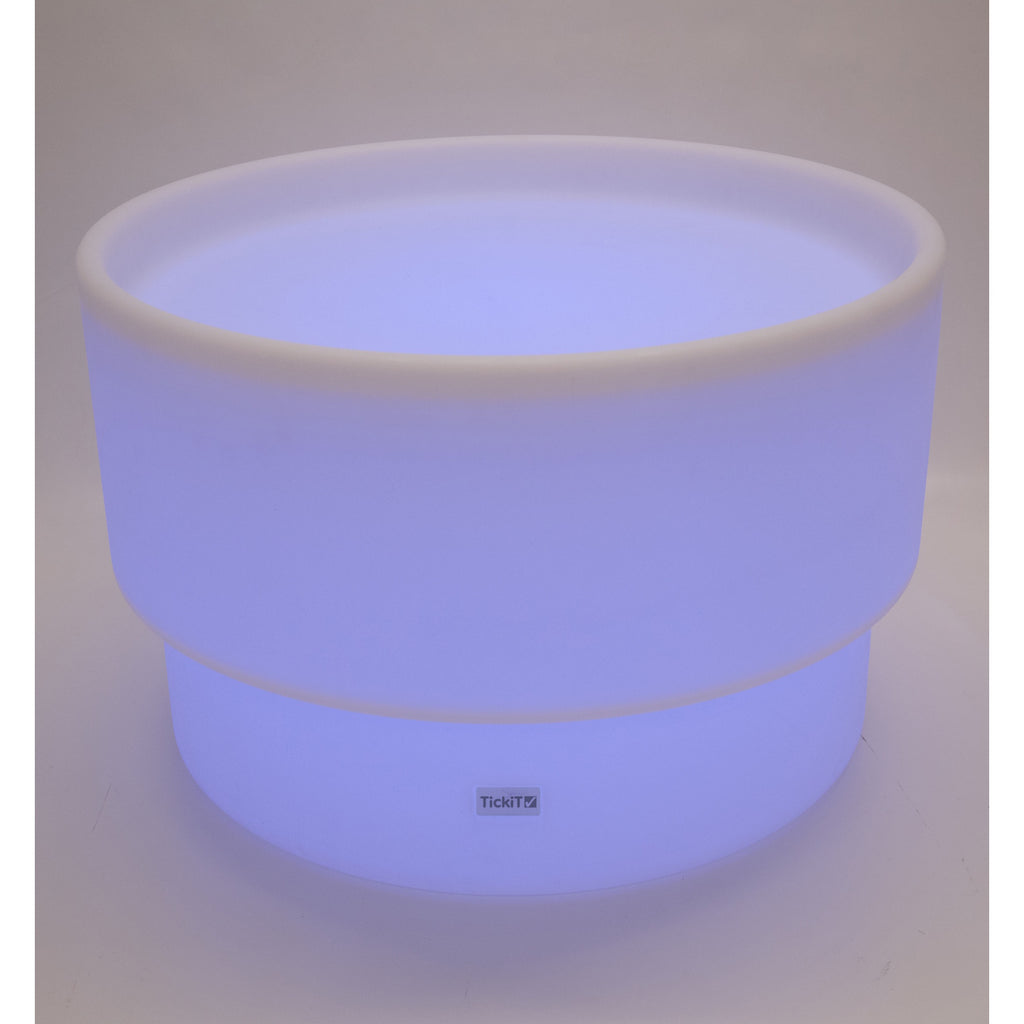 An illuminated LED table with a deep circular well, designed for sensory play, color exploration, and interactive learning activities.