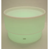 An illuminated LED table with a deep circular well, designed for sensory play, color exploration, and interactive learning activities.