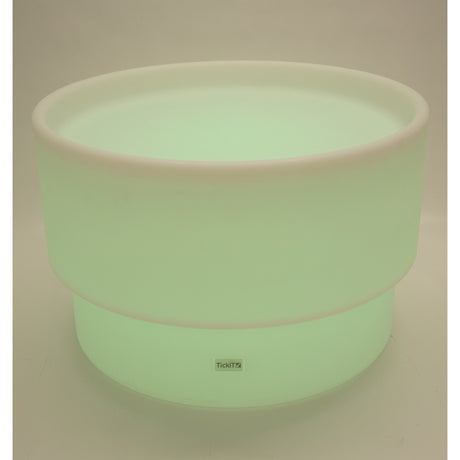 An illuminated LED table with a deep circular well, designed for sensory play, color exploration, and interactive learning activities.