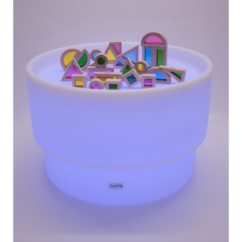 An illuminated LED table with a deep circular well, designed for sensory play, color exploration, and interactive learning activities.