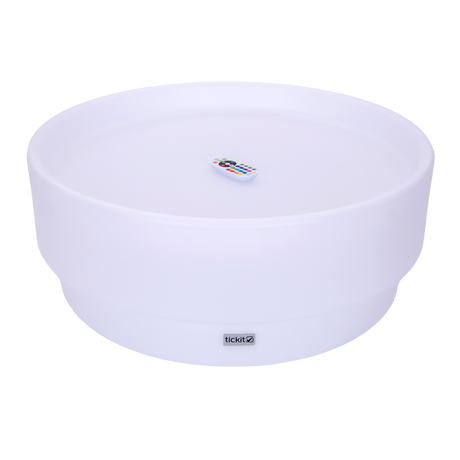 A softly glowing LED table with a shallow well, designed for sensory exploration, water play, and immersive learning experiences.