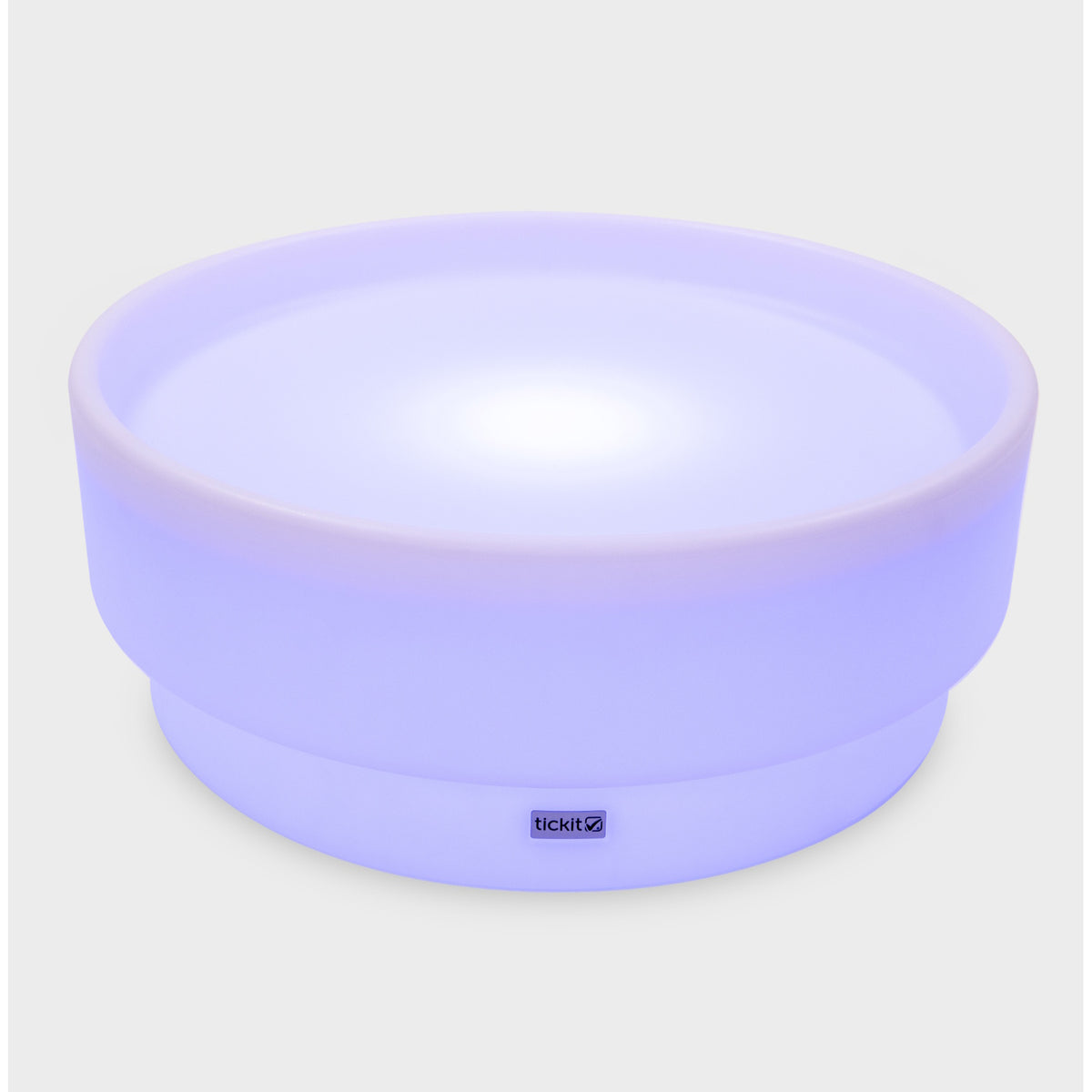 A softly glowing LED table with a shallow well, designed for sensory exploration, water play, and immersive learning experiences.