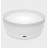 A softly glowing LED table with a shallow well, designed for sensory exploration, water play, and immersive learning experiences.