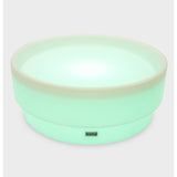 A softly glowing LED table with a shallow well, designed for sensory exploration, water play, and immersive learning experiences.