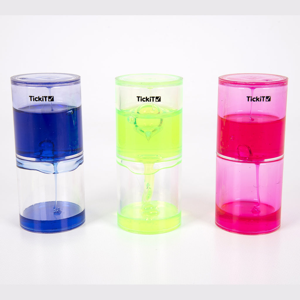 Three colorful liquid timers on a reflective surface: neon green, bright pink, and vivid blue. They convey a playful and dynamic mood.