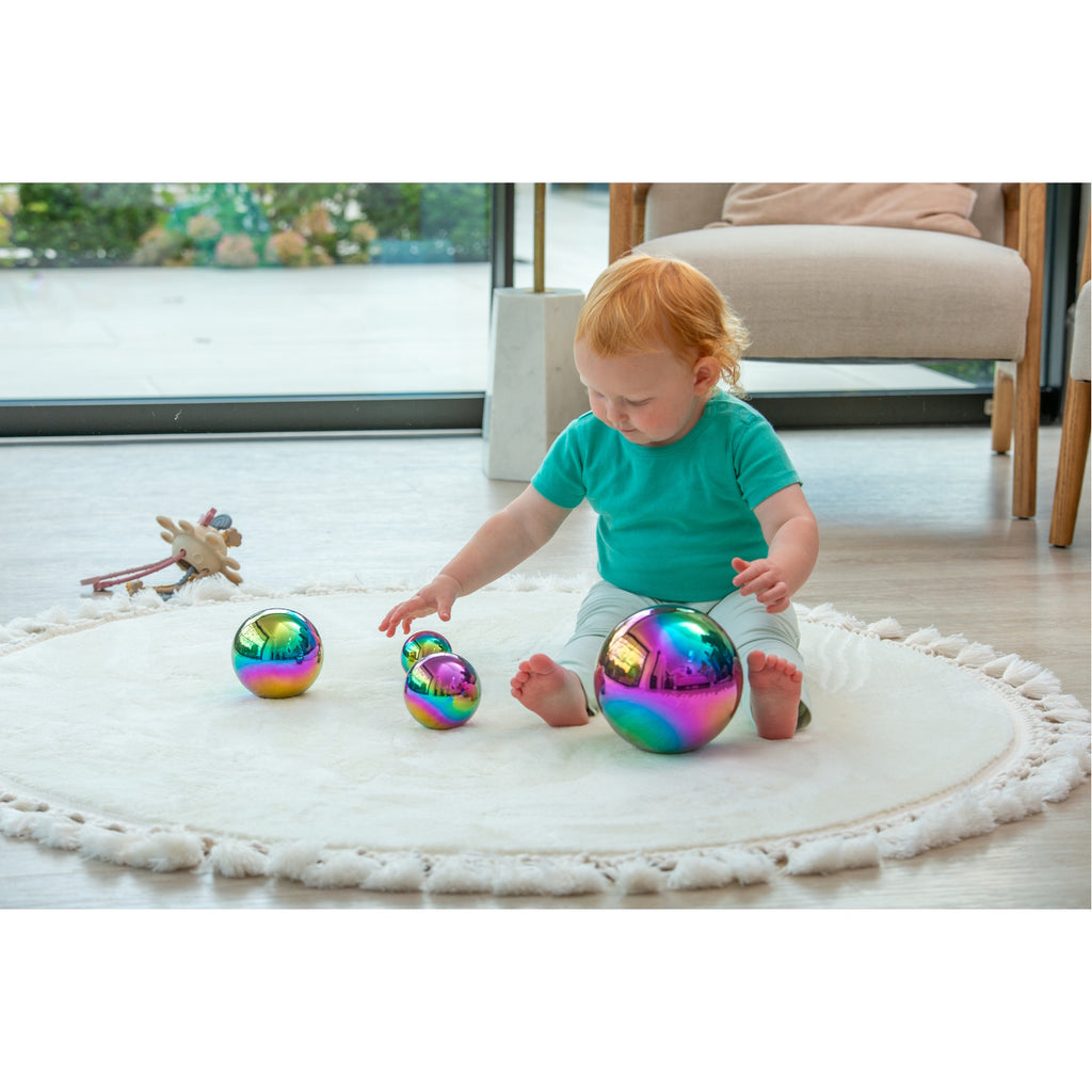 A set of colorful balls with reflective surfaces, designed to engage children in sensory play and visual stimulation.