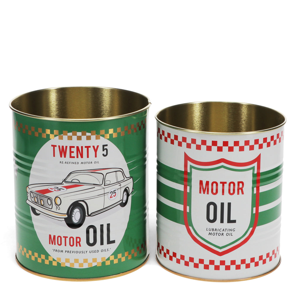 Two vintage-style motor oil tins, one green with a classic car design, labeled "Twenty 5," and one white with a shield, both featuring red and green checkered patterns.