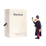 A minimalist Sherlock Holmes collectible toy stands next to a white box labeled "Sherlock." The toy holds a magnifying glass, evoking mystery and intrigue.