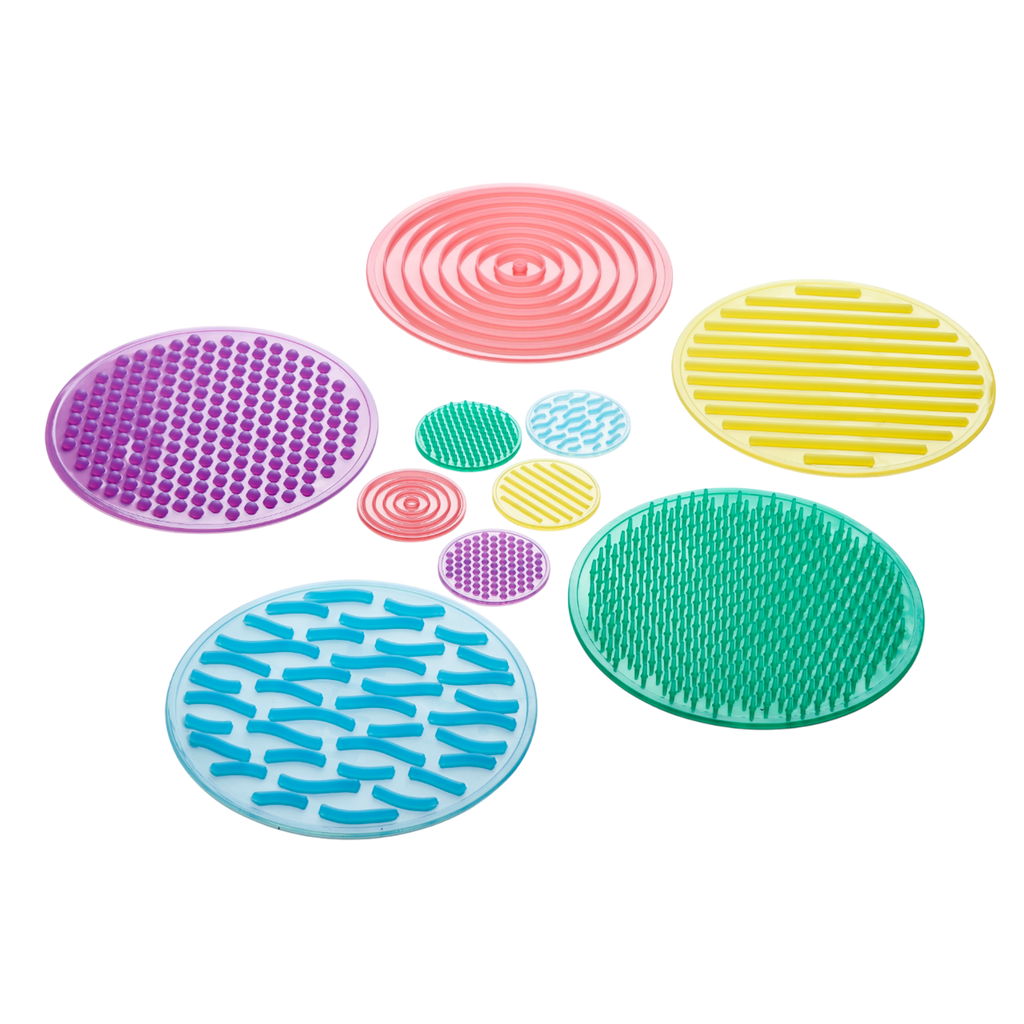 A set of textured silicone circles in various colors and patterns, designed to stimulate tactile exploration and sensory development in children.