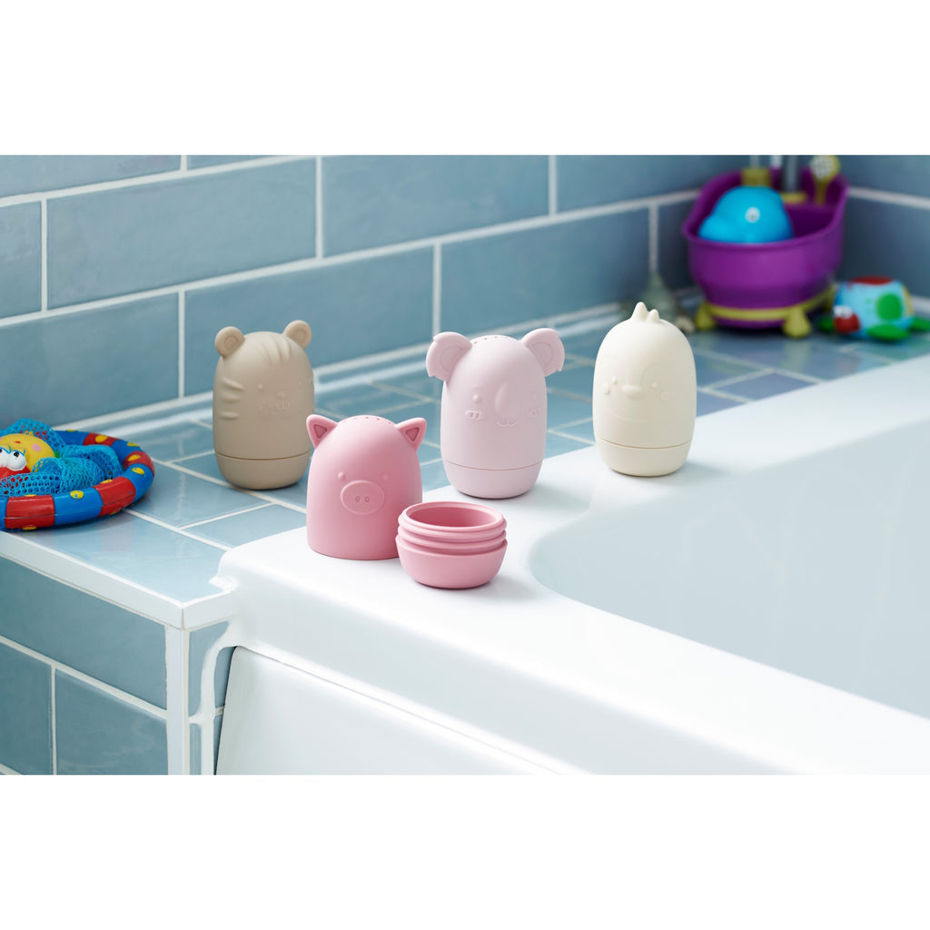 A set of soft silicone animal-shaped squirters in earthy tones, perfect for sensory play and water activities, designed for young children.