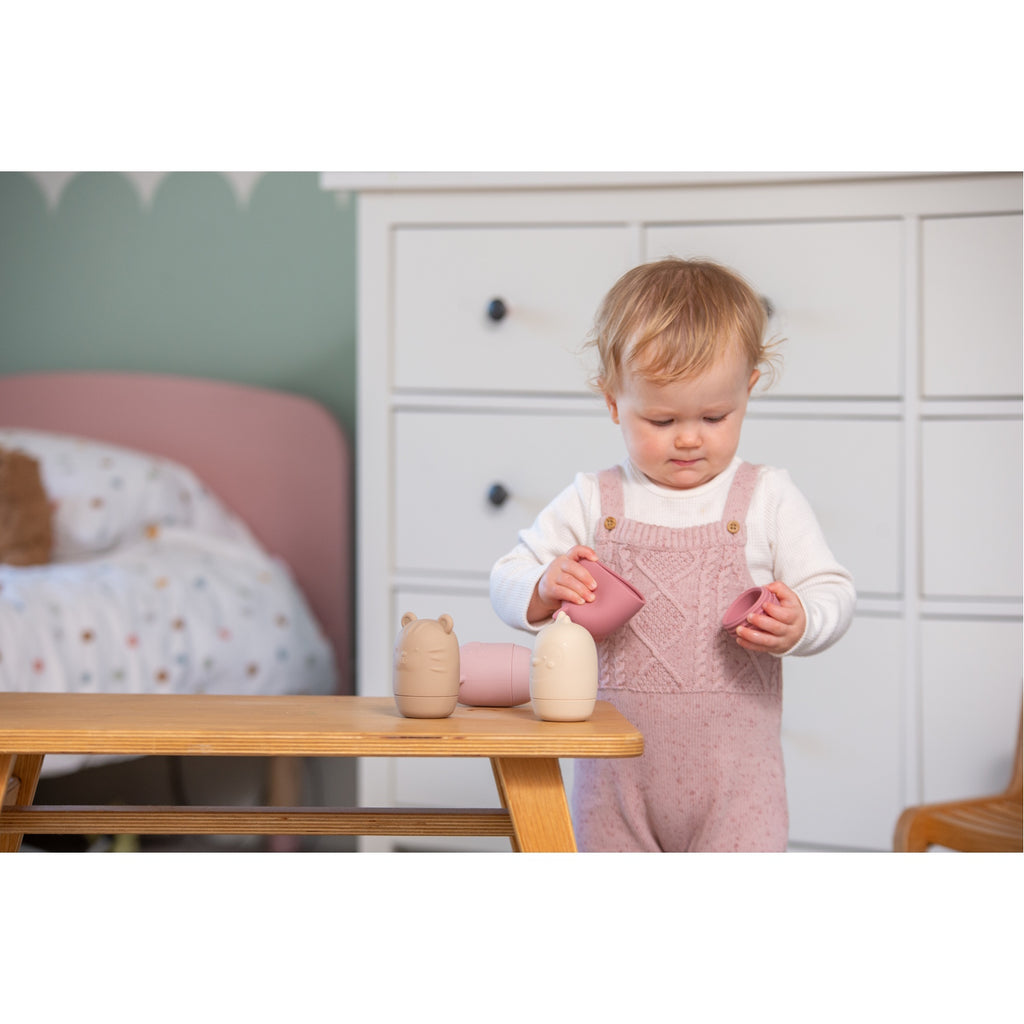A set of soft silicone animal-shaped squirters in earthy tones, perfect for sensory play and water activities, designed for young children.