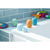 A set of soft silicone animal-shaped squirters in neutral tones, designed for sensory play and water-based fun, perfect for young children.