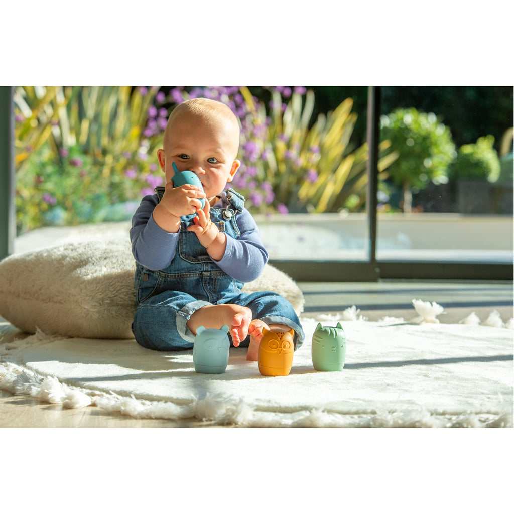 A set of soft silicone animal-shaped squirters in neutral tones, designed for sensory play and water-based fun, perfect for young children.