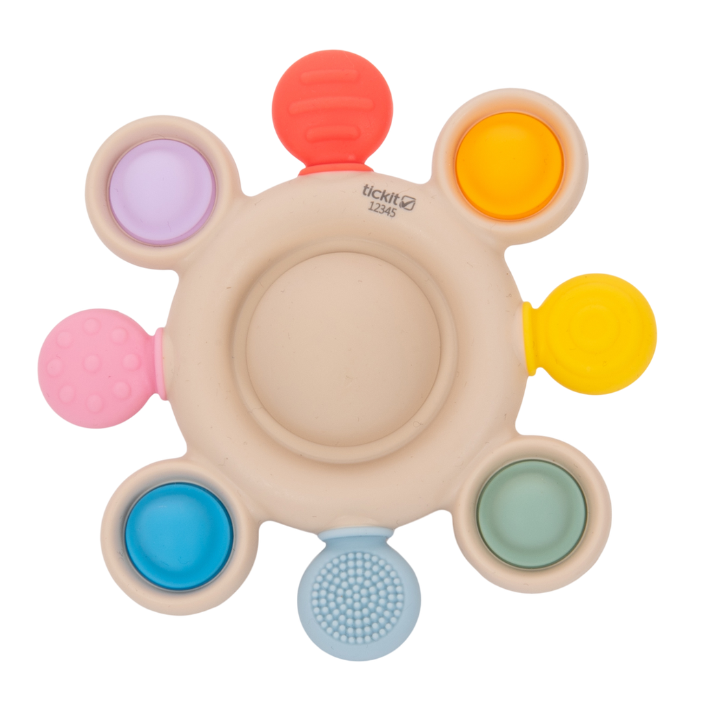 A vibrant silicone teether with popping textures, designed to soothe and engage babies while promoting sensory and tactile development.
