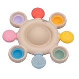 A vibrant silicone teether with popping textures, designed to soothe and engage babies while promoting sensory and tactile development.