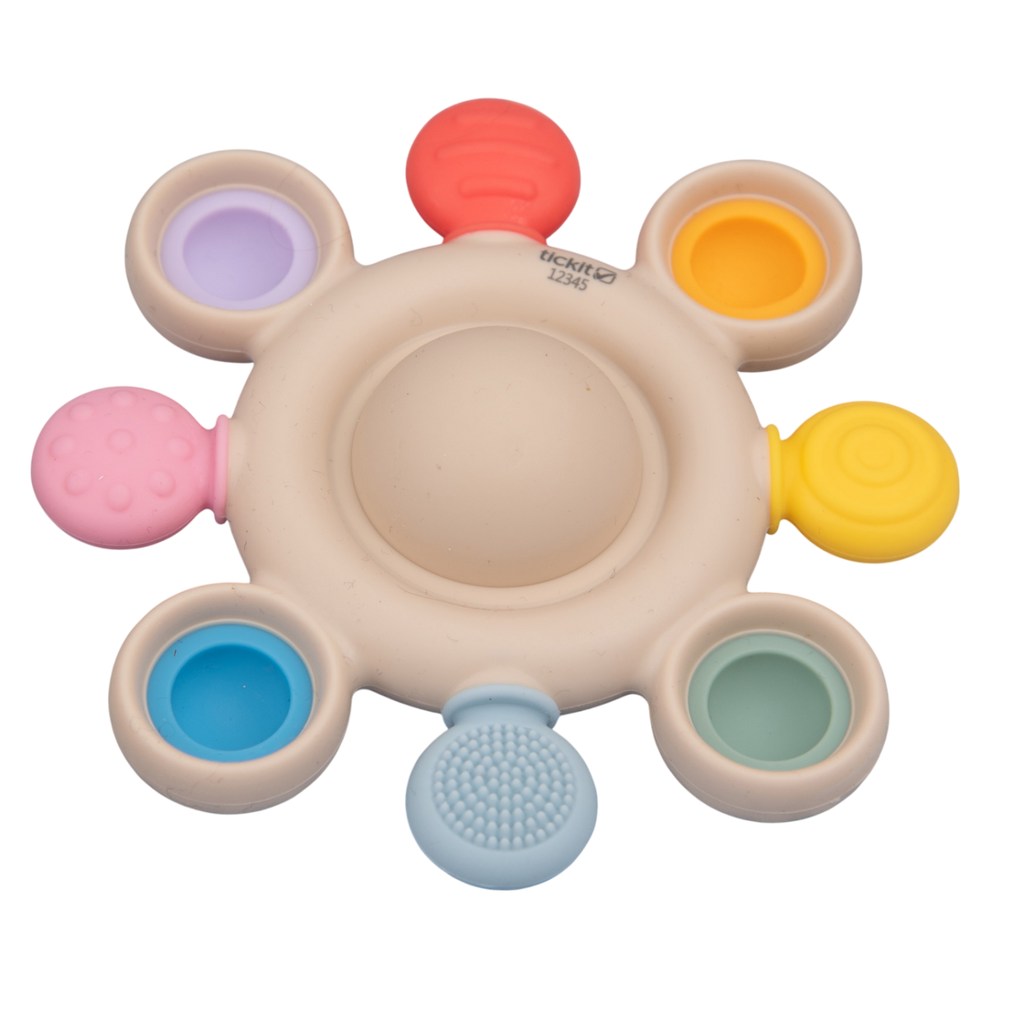 A vibrant silicone teether with popping textures, designed to soothe and engage babies while promoting sensory and tactile development.