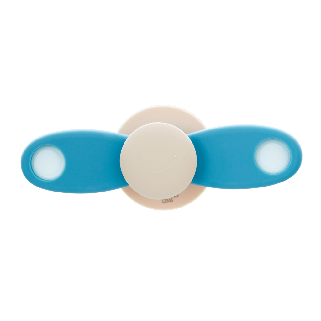 A soft silicone toy featuring a propeller design in neutral tones, ideal for sensory exploration and fine motor skill development.