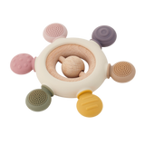 A soft silicone teether with a built-in rattle, designed in earthy tones to soothe and engage babies while promoting sensory development.