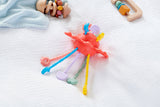 A colorful silicone pull toy with textured zip-like ridges, designed to support sensory development and fine motor skills in young children.