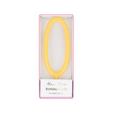 Yellow slim number 0 birthday candle packaged in a clear box by Meri Meri.