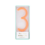 Peach-orange slim number 3 birthday candle packaged in a clear box by Meri Meri.