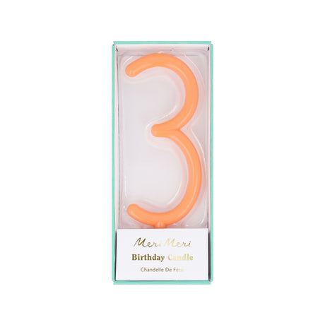 Peach-orange slim number 3 birthday candle packaged in a clear box by Meri Meri.