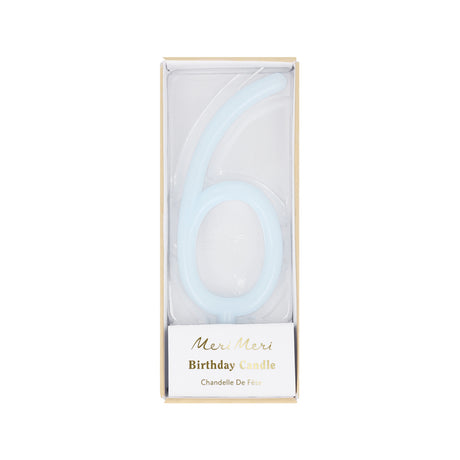 Light blue slim number 6 birthday candle packaged in a clear box by Meri Meri.