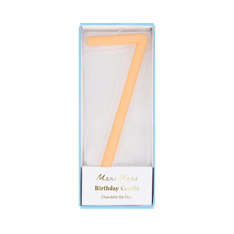 Peach-orange slim number 7 birthday candle packaged in a clear box by Meri Meri.