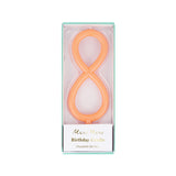 Peach-orange slim number 8 birthday candle packaged in a clear plastic box by Meri Meri.