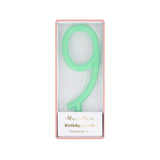 Mint green number 9 birthday candle packaged inside a pink box with Meri Meri branding.