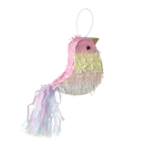 A colorful bird-shaped piñata with pastel pink, yellow, and white fringes and a long tail. The background is solid white, highlighting the piñata.