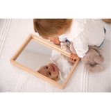A compact wooden tray with a mirrored base, perfect for sensory play, loose parts exploration, and visual perception activities.