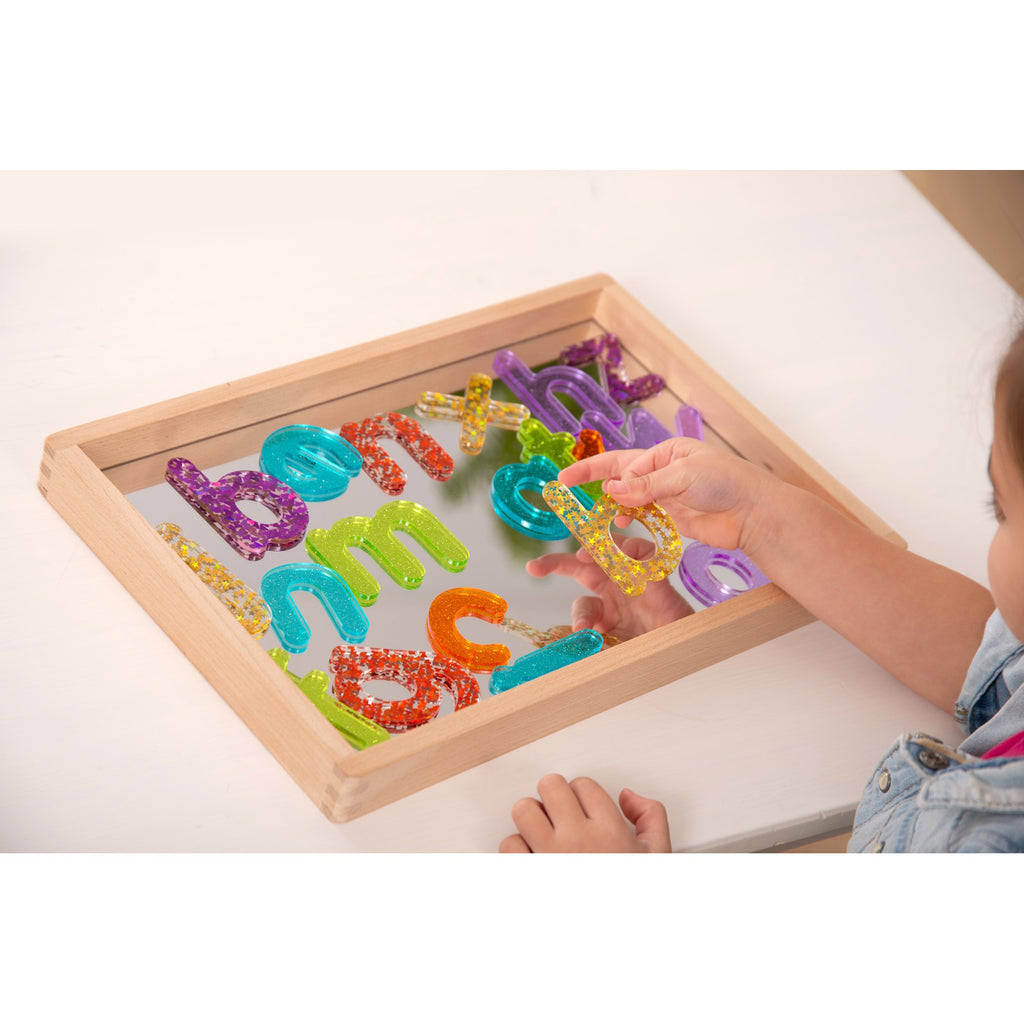 A compact wooden tray with a mirrored base, perfect for sensory play, loose parts exploration, and visual perception activities.