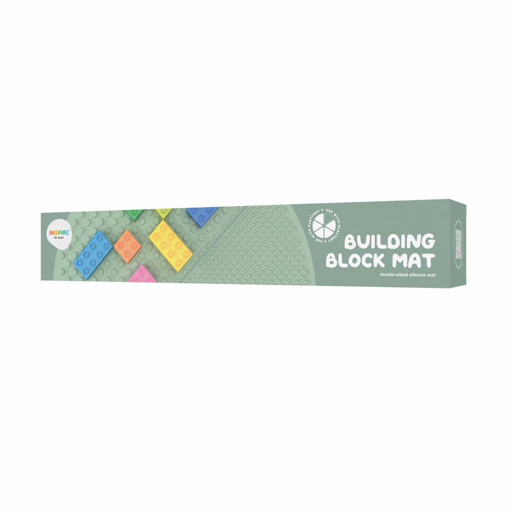 Packaging for a Building Block Mat, featuring colorful plastic bricks on a light green background. The text reads "Building Block Mat, double-sided silicone mat."