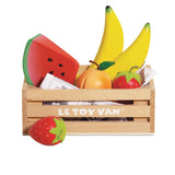Wooden toy fruit set in a Le Toy Van crate with a strawberry sitting in front.