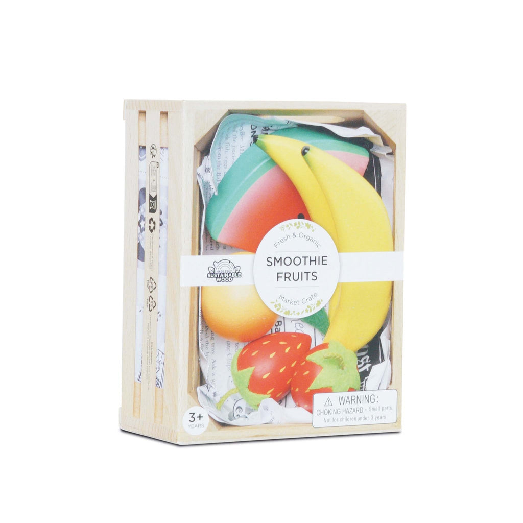 Toy wooden crate of colorful play fruits, including a banana and strawberry, labeled "Smoothie Fruits." Intended for ages 3+, with a choking hazard warning.