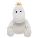 Plush toy resembling a white hippo with round eyes, small ears, and a tuft of blond hair on top. It sits upright, conveying a friendly and cute demeanor.